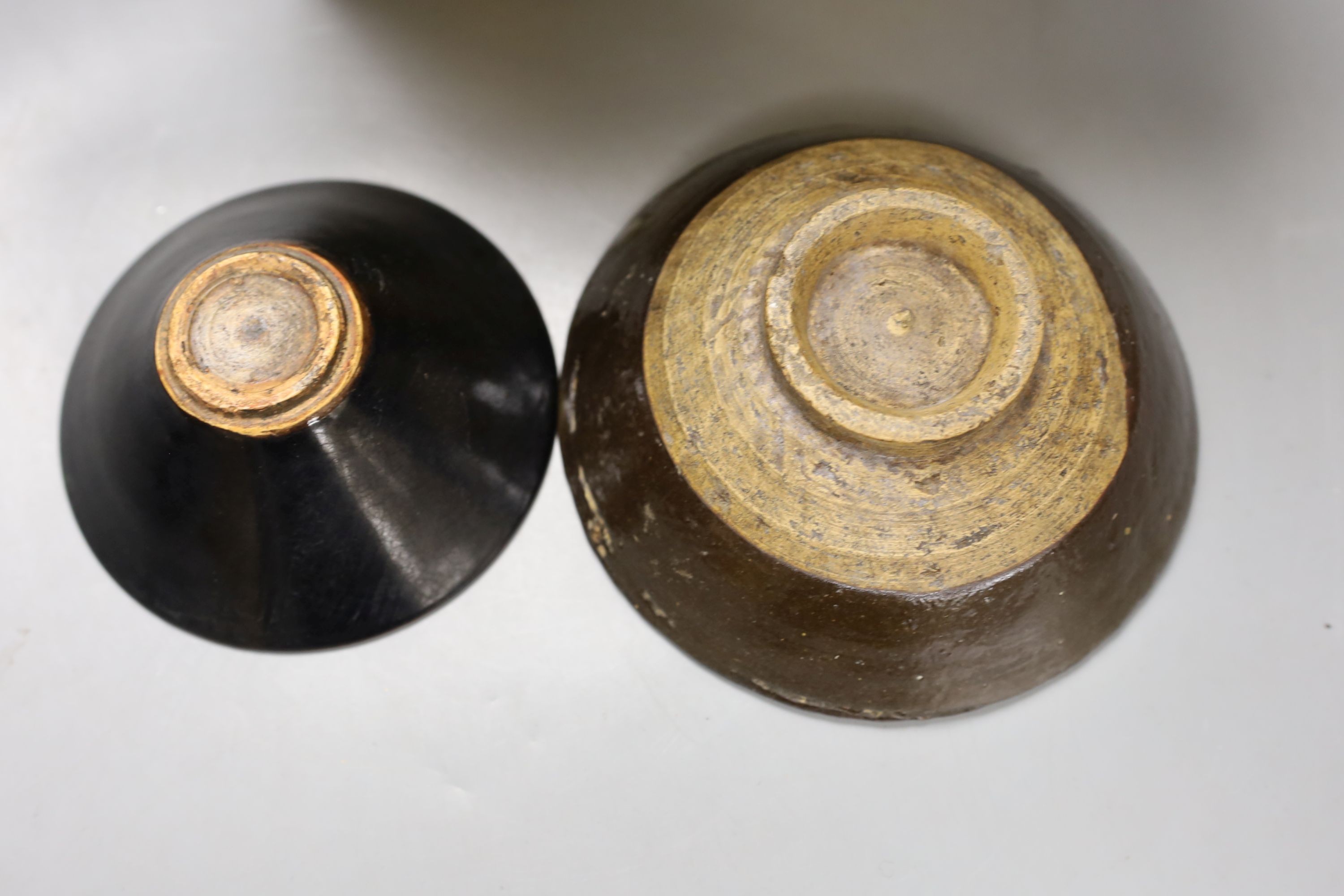 A group of Chinese monochrome ceramics, comprising two crackle glaze vases, tallest 21 cm, one cased, a Jun type dish and tripod censer a leaf impressed bowl and another bowl